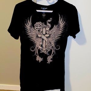 Studded with wings and roses